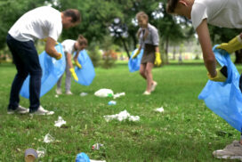 Friendly family organized cleaning day to clean park of household garbage